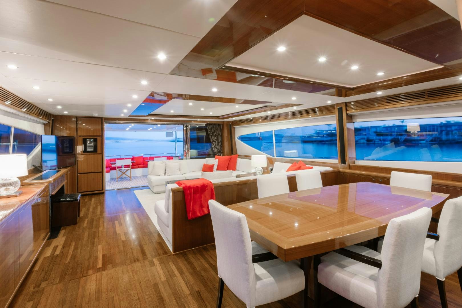 a room with a table chairs and a large window aboard LOVE N LIFE Yacht for Sale