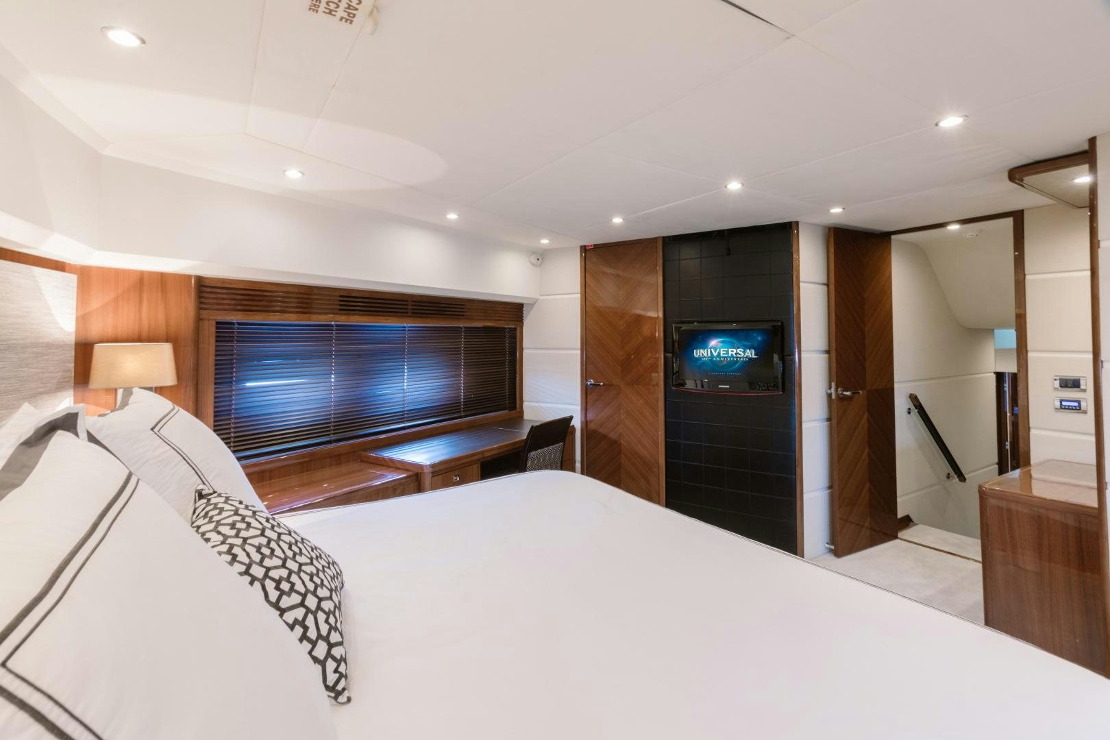 a hotel room with a bed and tv aboard LOVE N LIFE Yacht for Sale