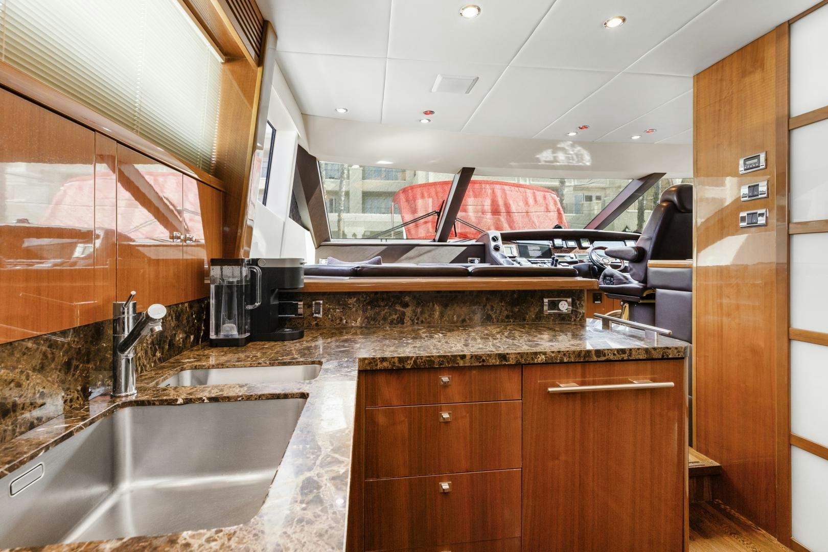 a kitchen with wooden cabinets aboard LOVE N LIFE Yacht for Sale