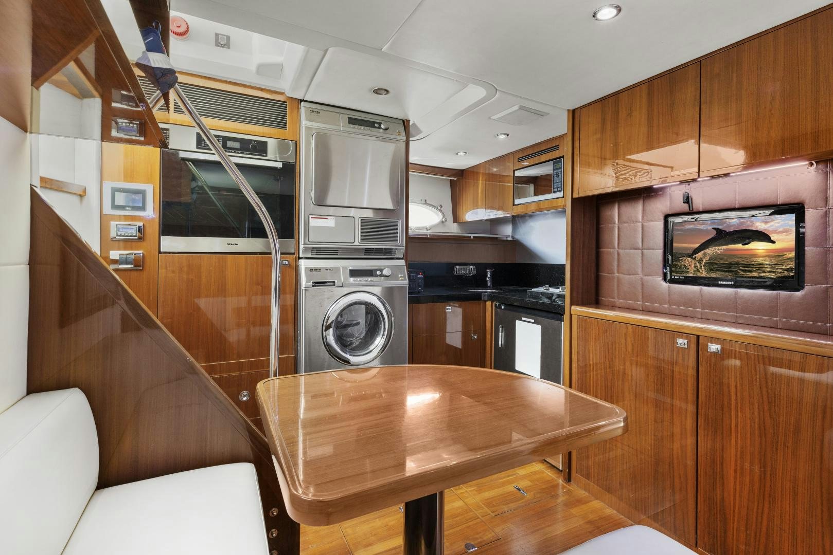 a kitchen with wooden cabinets aboard LOVE N LIFE Yacht for Sale
