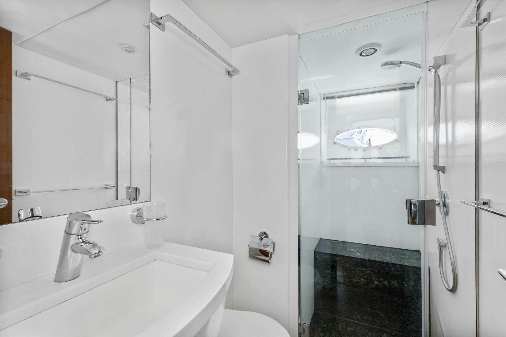 a bathroom with a sink and a shower aboard LOVE N LIFE Yacht for Sale