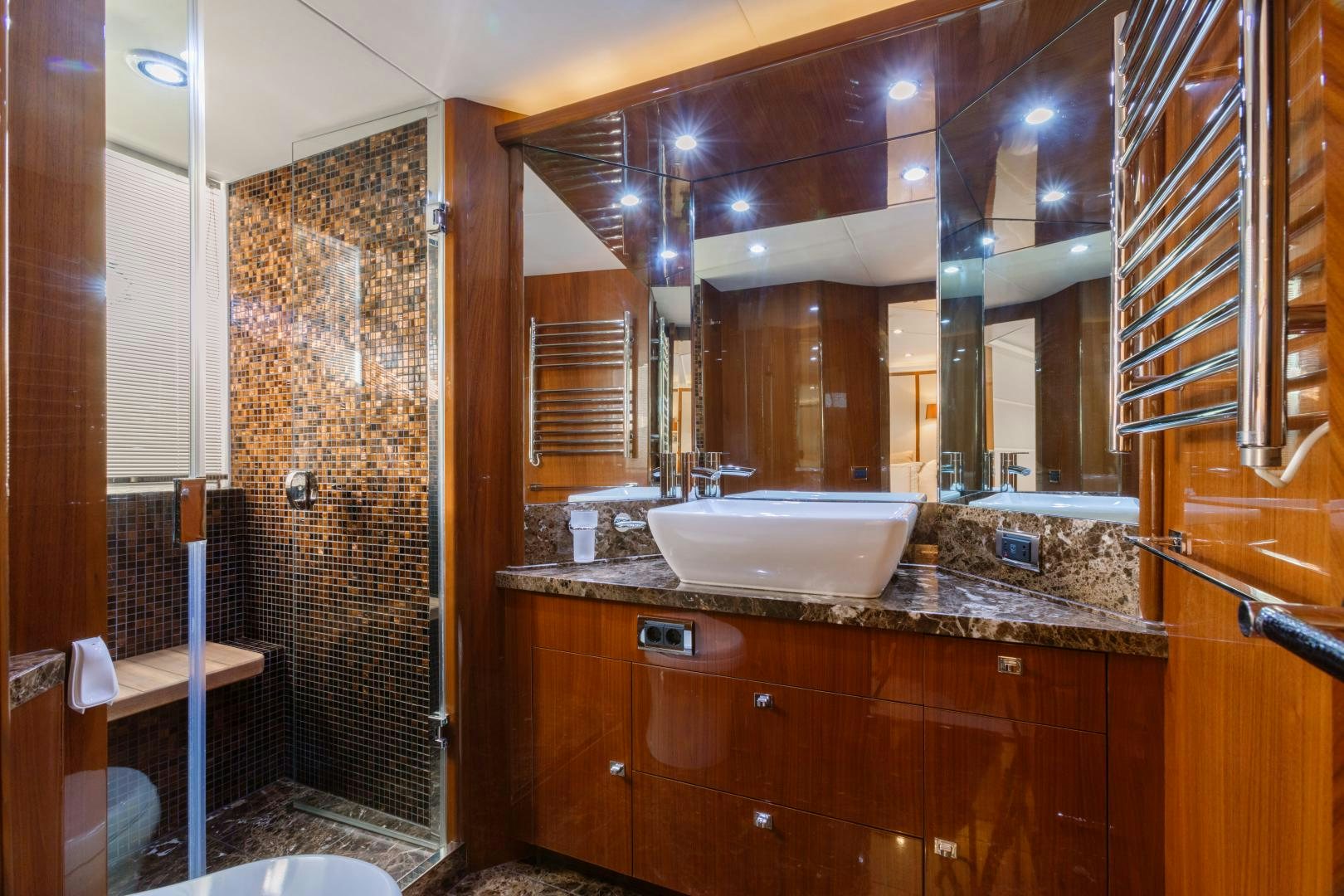 a bathroom with a sink and a mirror aboard LOVE N LIFE Yacht for Sale