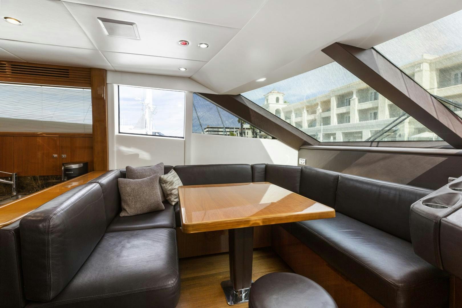 a living room with a couch and a table aboard LOVE N LIFE Yacht for Sale