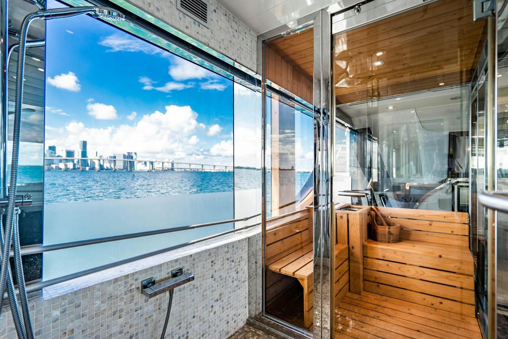 a room with a view of the city and water aboard PRIVILEGE Yacht for Sale