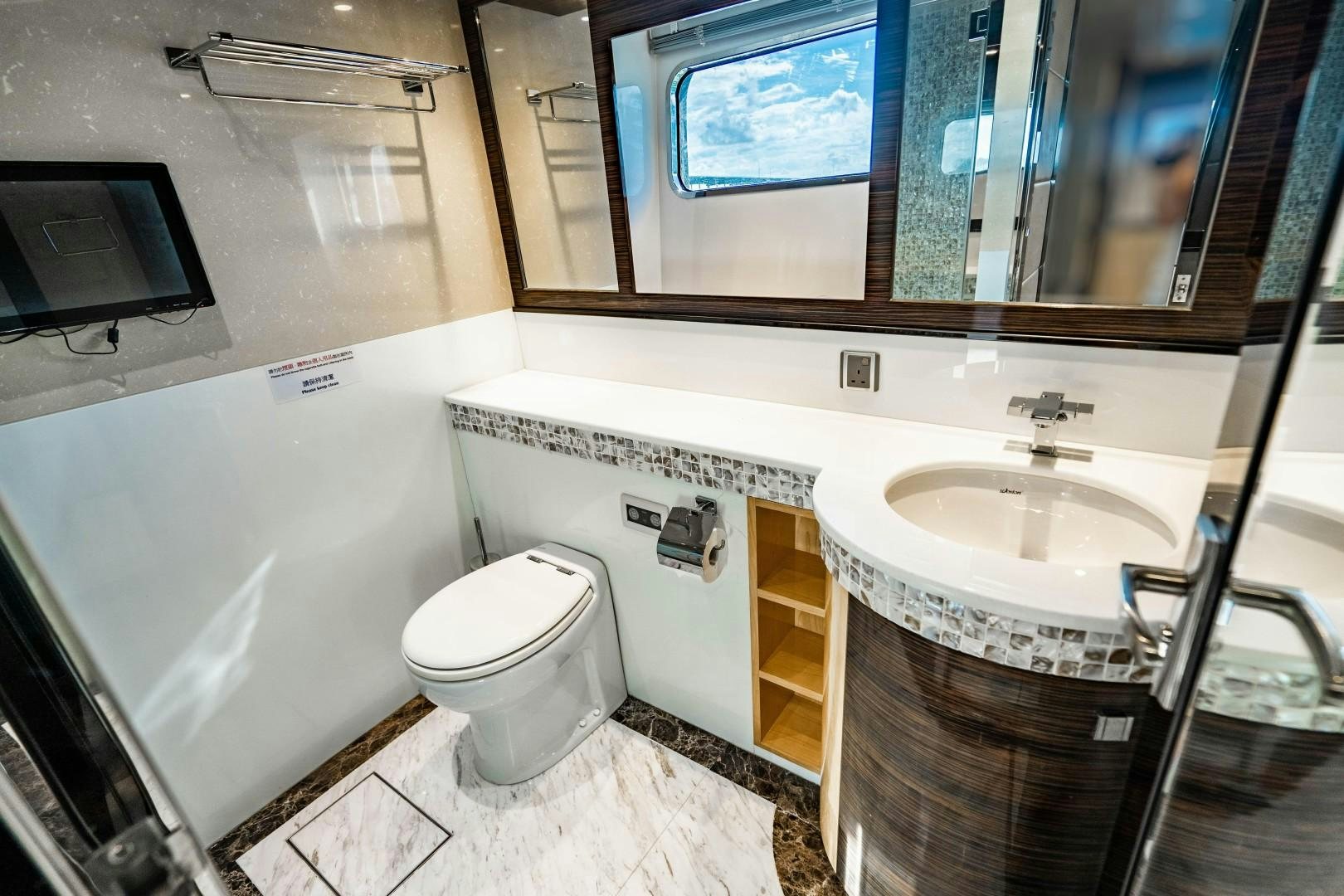 a bathroom with a sink and toilet aboard PRIVILEGE Yacht for Sale
