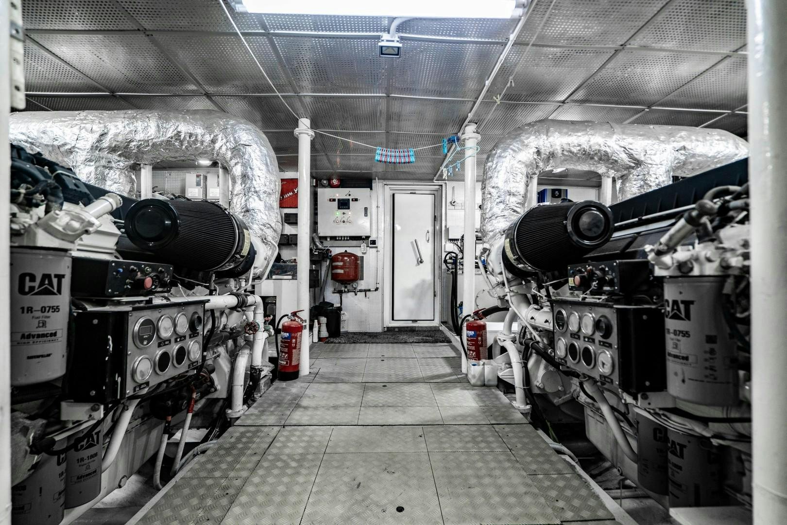a room with large machinery aboard PRIVILEGE Yacht for Sale