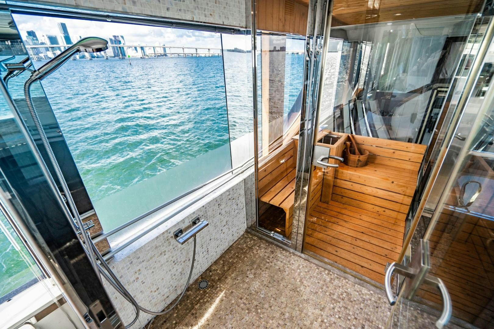 a room with a glass door and a pool aboard PRIVILEGE Yacht for Sale