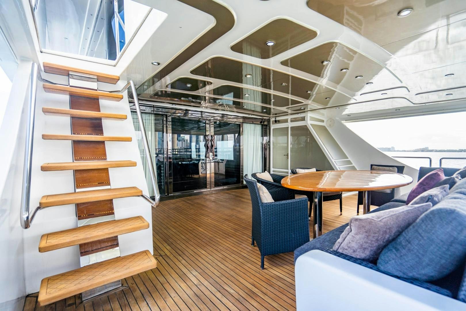 a room with a bunk bed and a table aboard PRIVILEGE Yacht for Sale