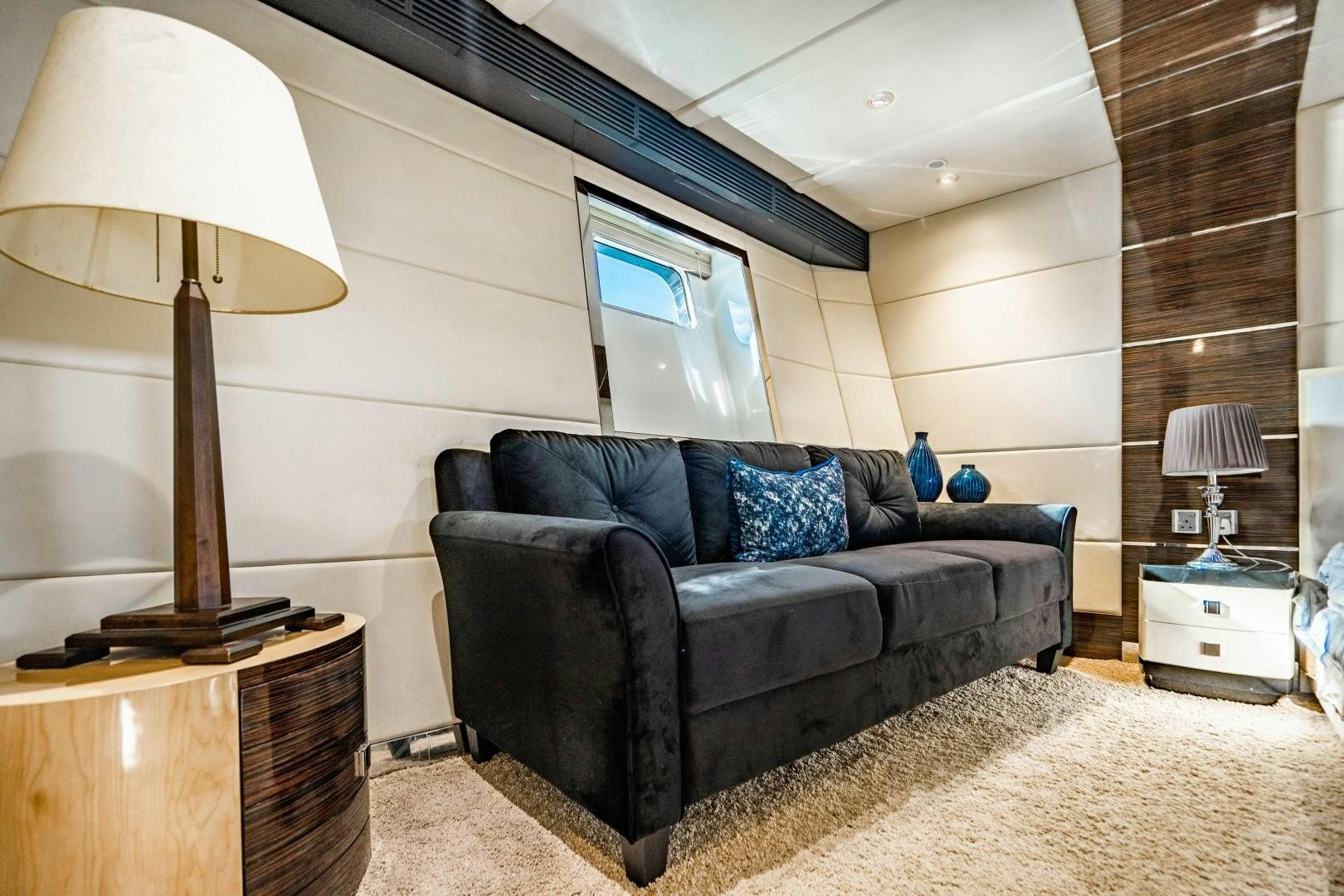 a living room with a couch and a lamp aboard PRIVILEGE Yacht for Sale