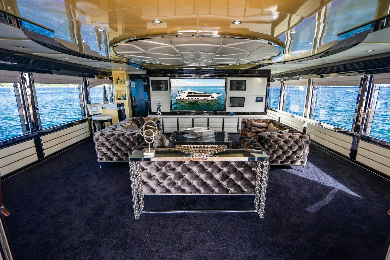 a room with a couch and a table aboard PRIVILEGE Yacht for Sale