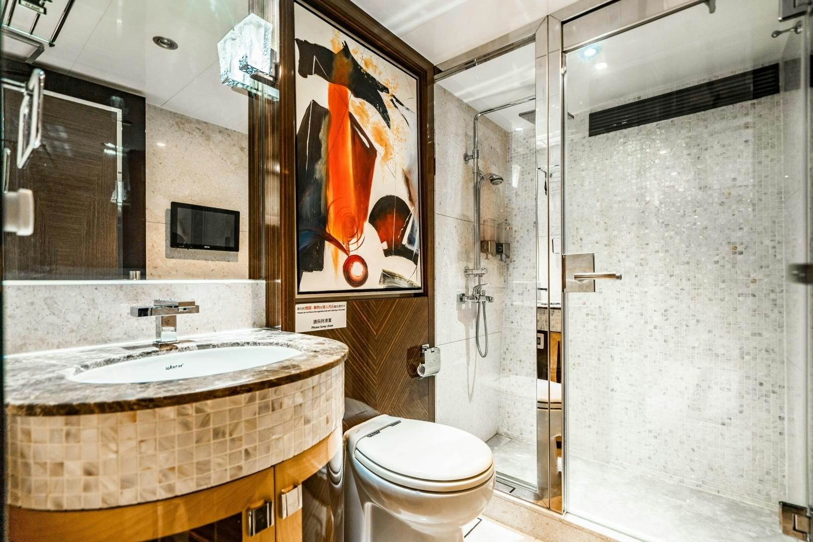 a bathroom with a large mirror aboard PRIVILEGE Yacht for Sale