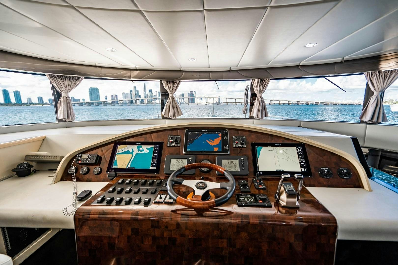a cockpit with a few laptops and screens aboard PRIVILEGE Yacht for Sale
