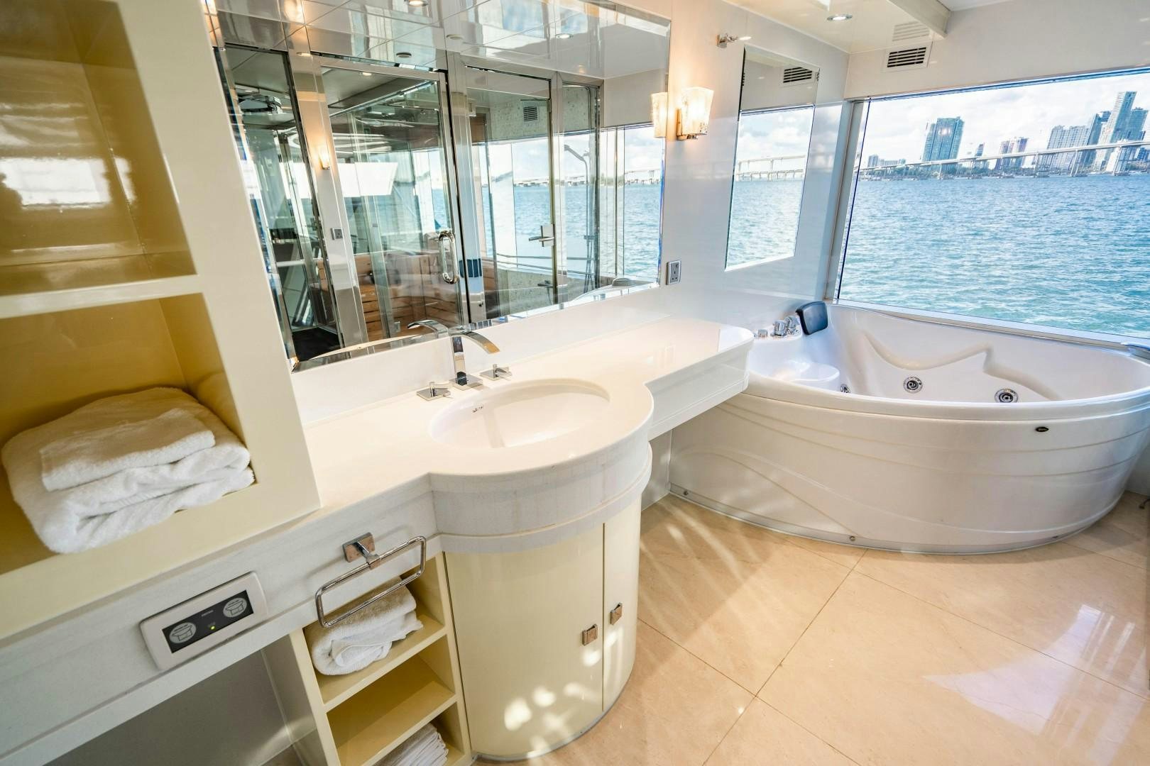 a bathroom with a sink and a bathtub aboard PRIVILEGE Yacht for Sale