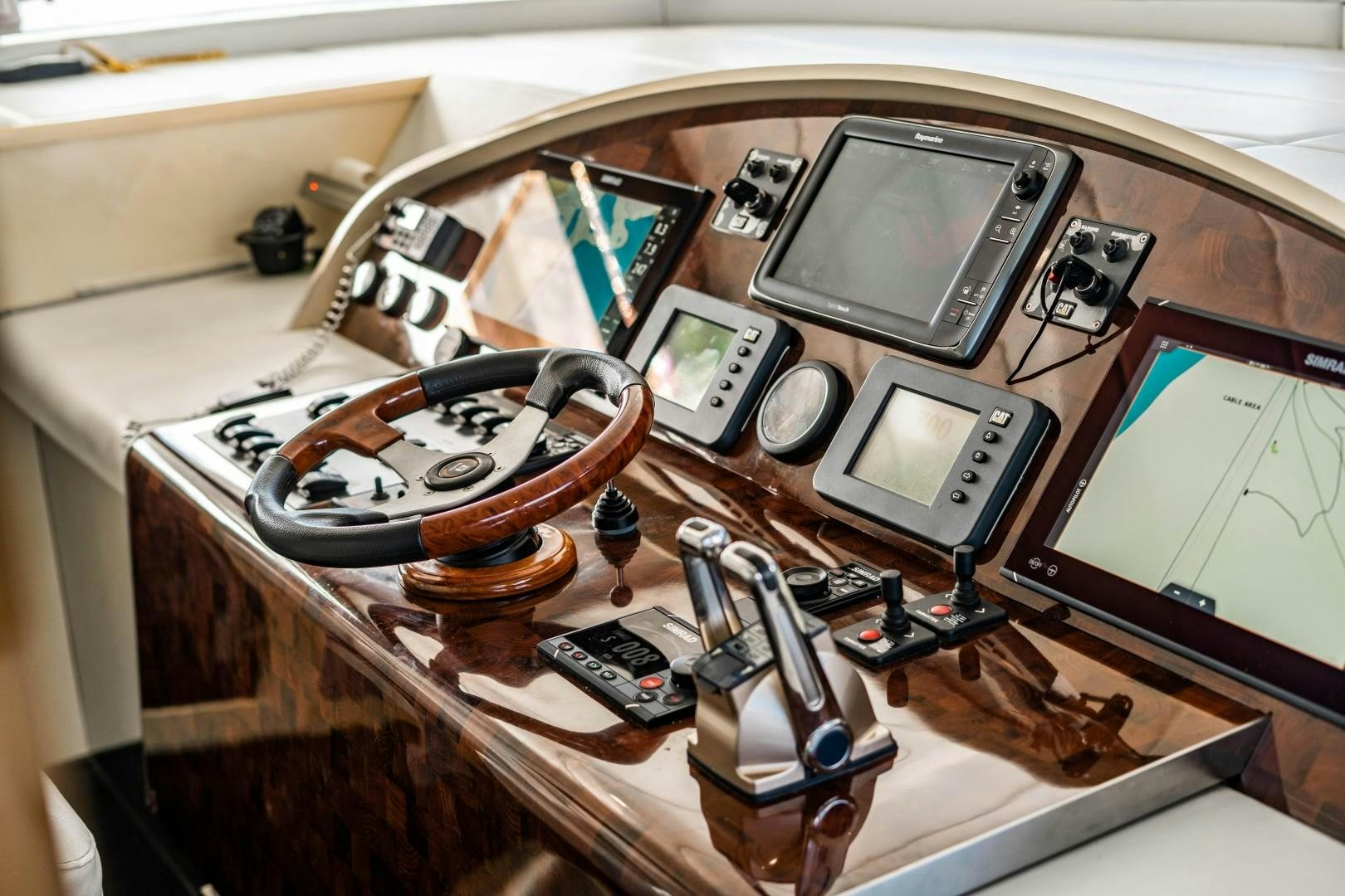 a wooden box with a few electronic devices inside aboard PRIVILEGE Yacht for Sale
