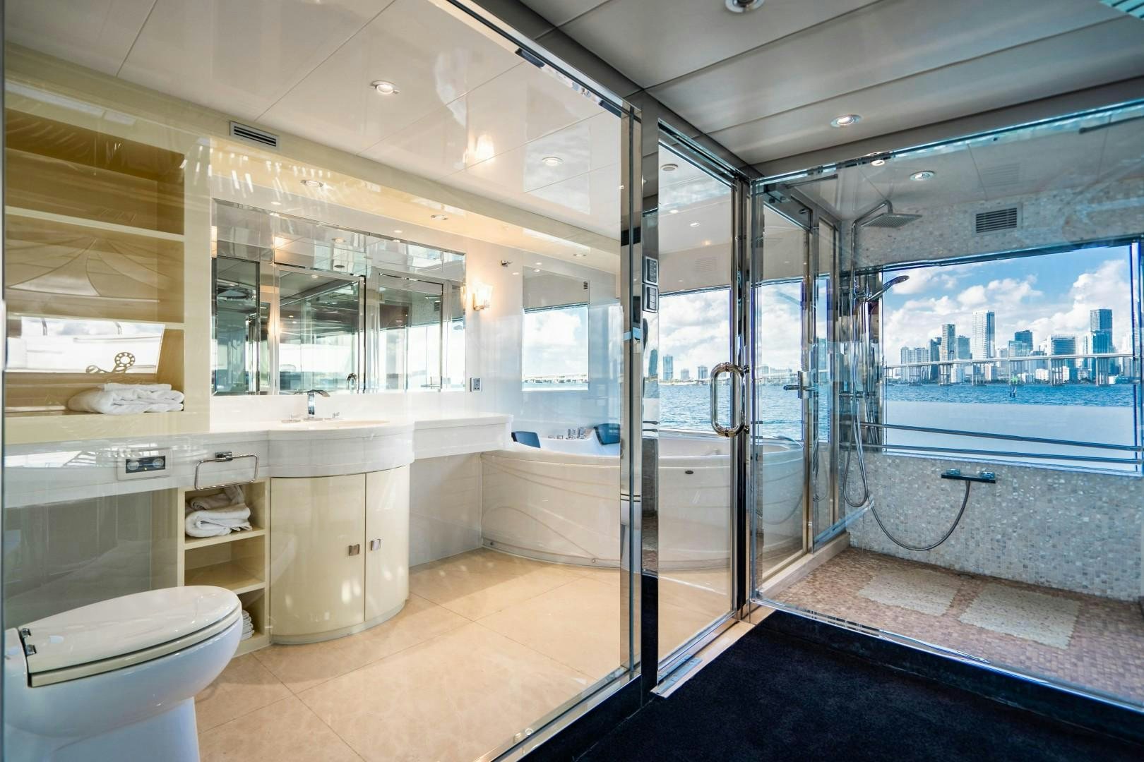 a bathroom with a glass shower aboard PRIVILEGE Yacht for Sale