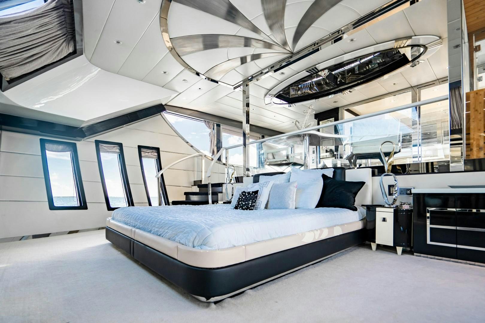 a large room with a bed and a fan aboard PRIVILEGE Yacht for Sale