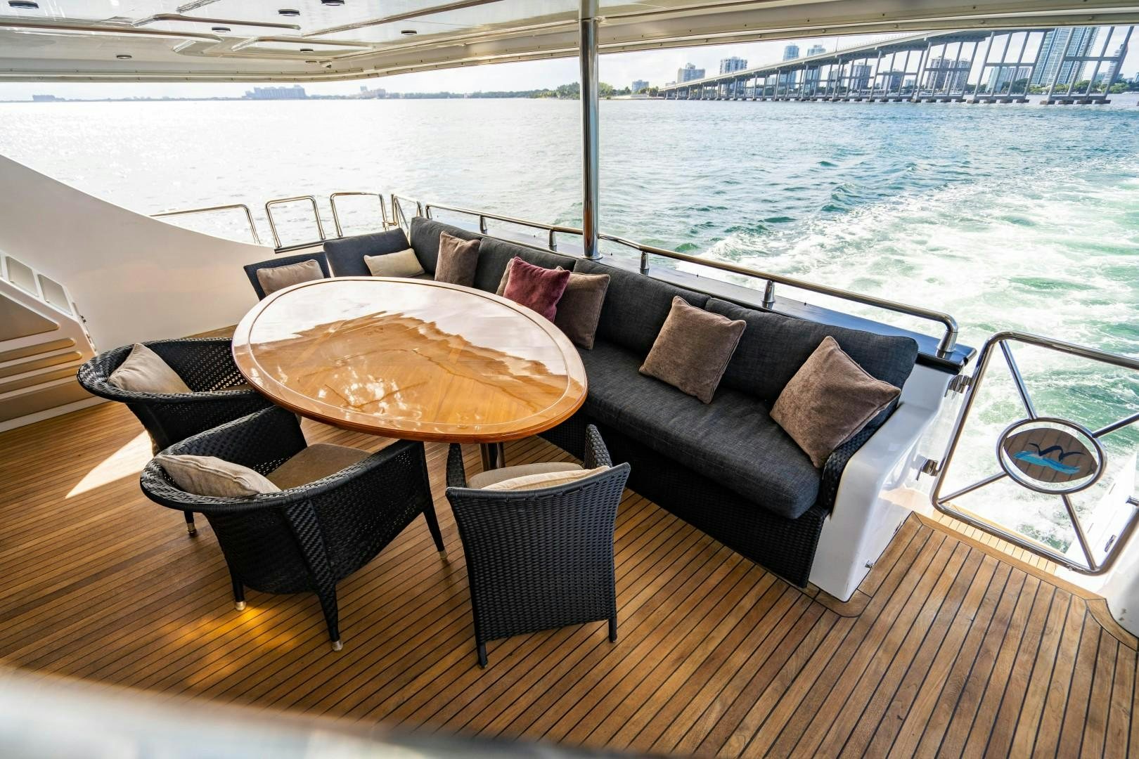 a couch and chairs on a deck aboard PRIVILEGE Yacht for Sale