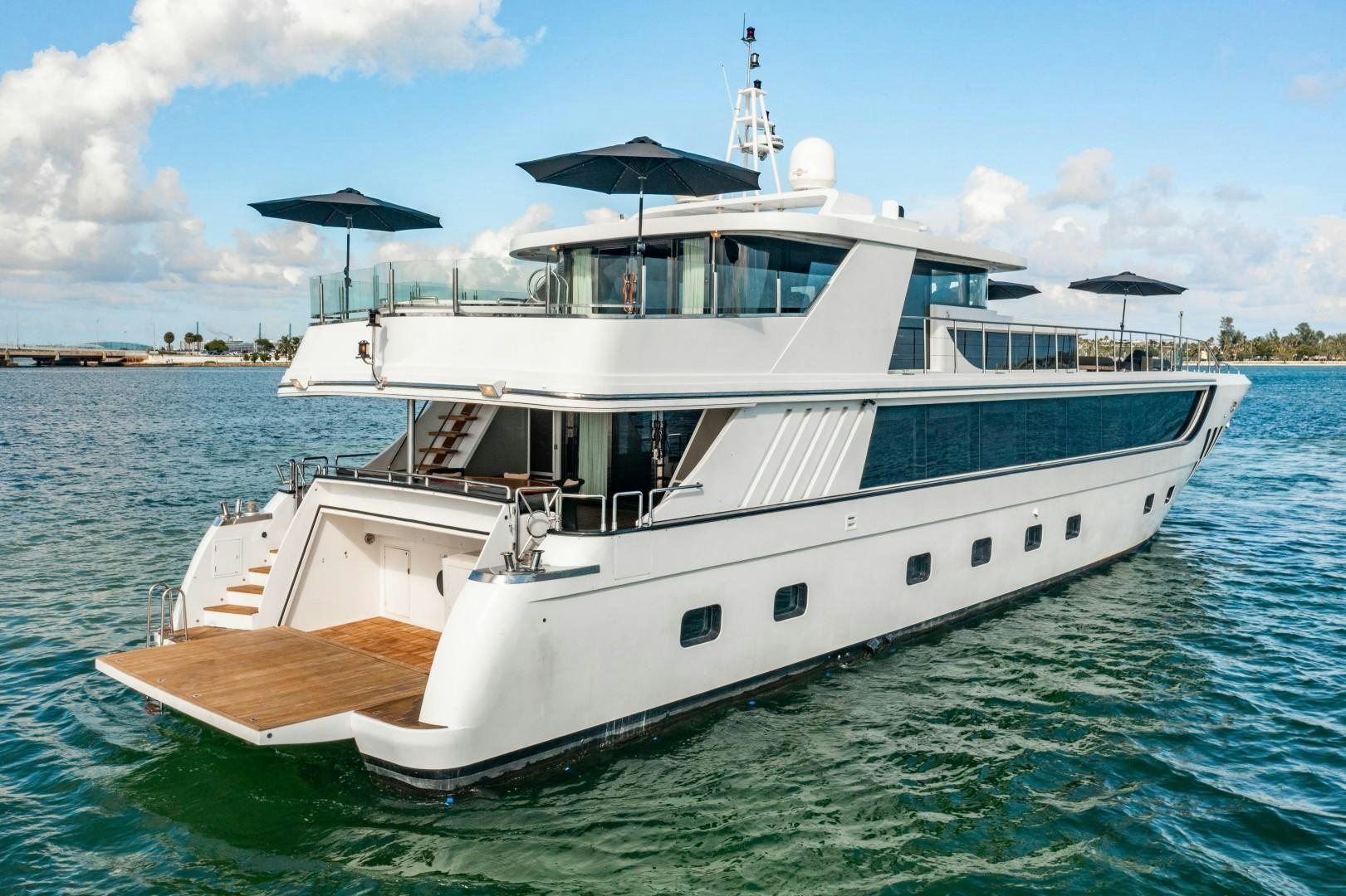 a large white boat on the water aboard PRIVILEGE Yacht for Sale