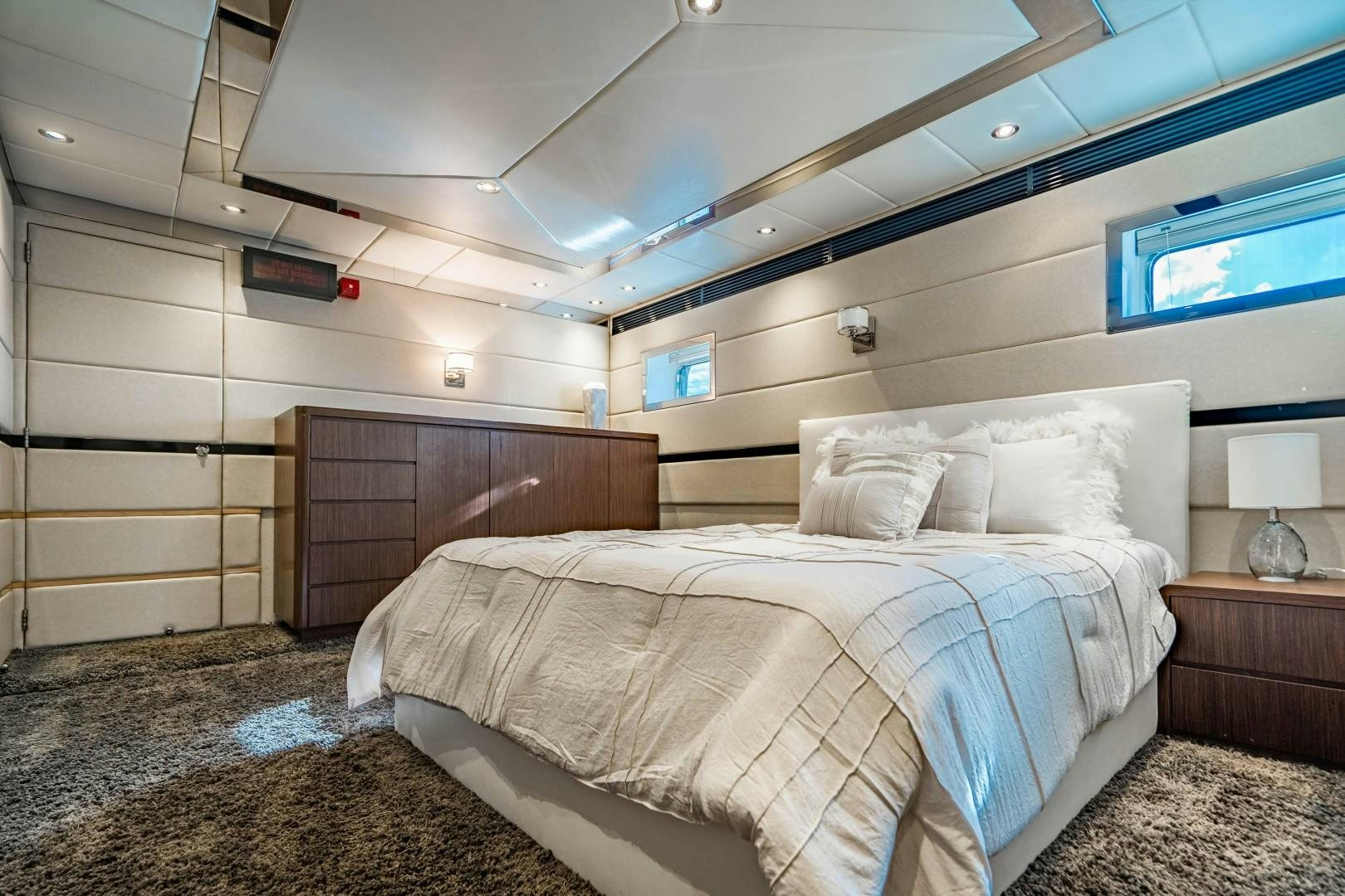 a room with a bed and a television aboard PRIVILEGE Yacht for Sale