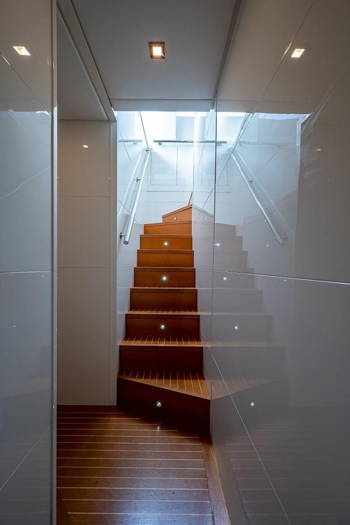 a hallway with glass doors aboard CASSINELLA Yacht for Sale