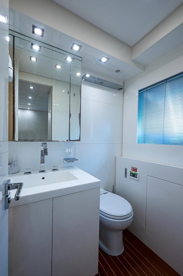 a bathroom with a sink and a toilet aboard CASSINELLA Yacht for Sale