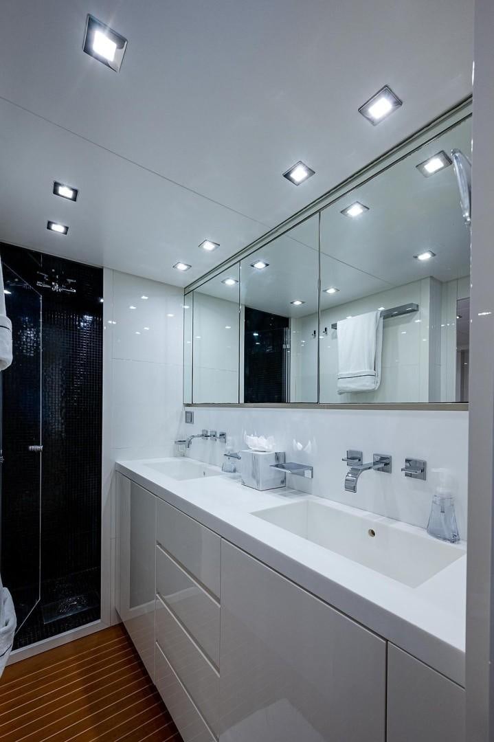 a bathroom with a large mirror aboard CASSINELLA Yacht for Sale