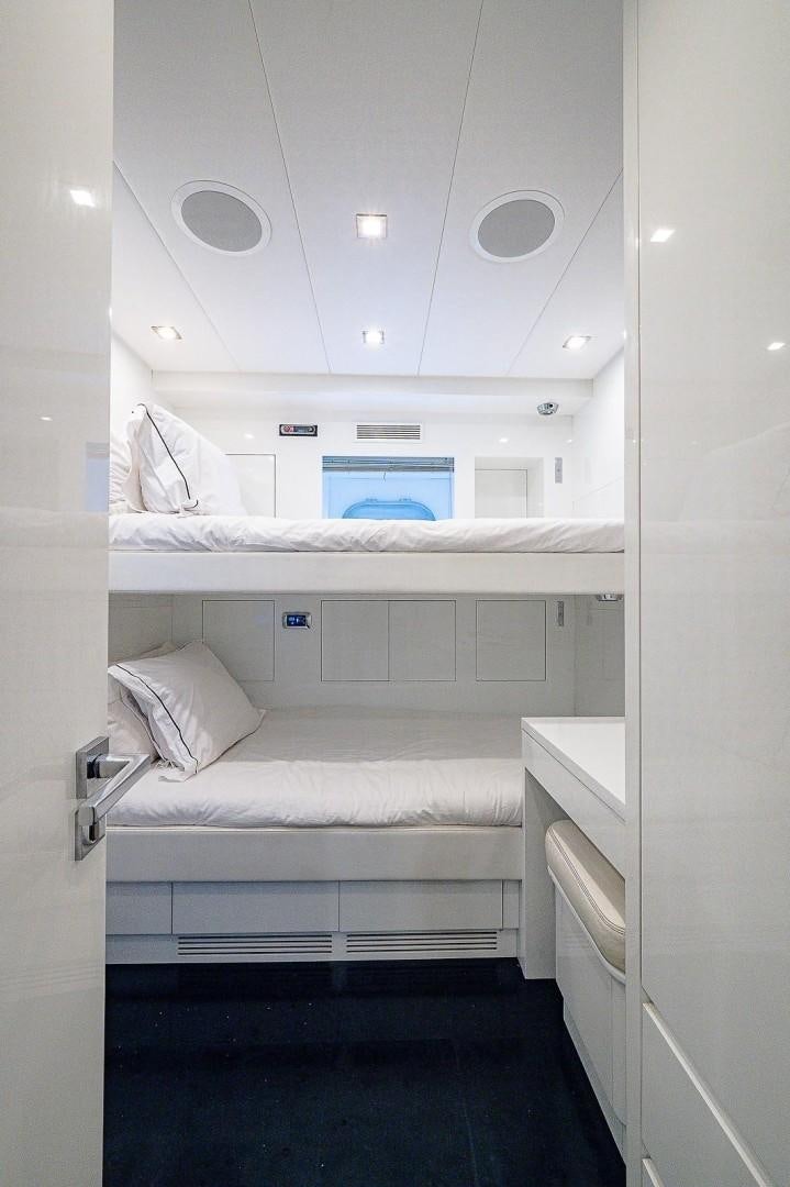 a room with a bed and a mirror aboard CASSINELLA Yacht for Sale
