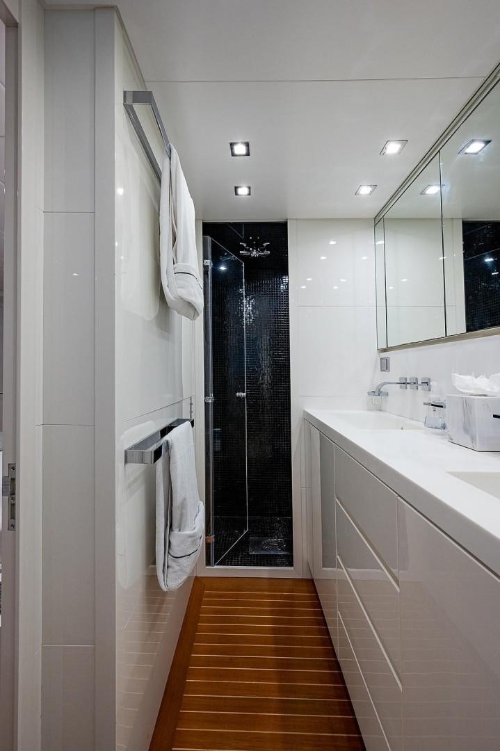 a bathroom with a shower and sink aboard CASSINELLA Yacht for Sale