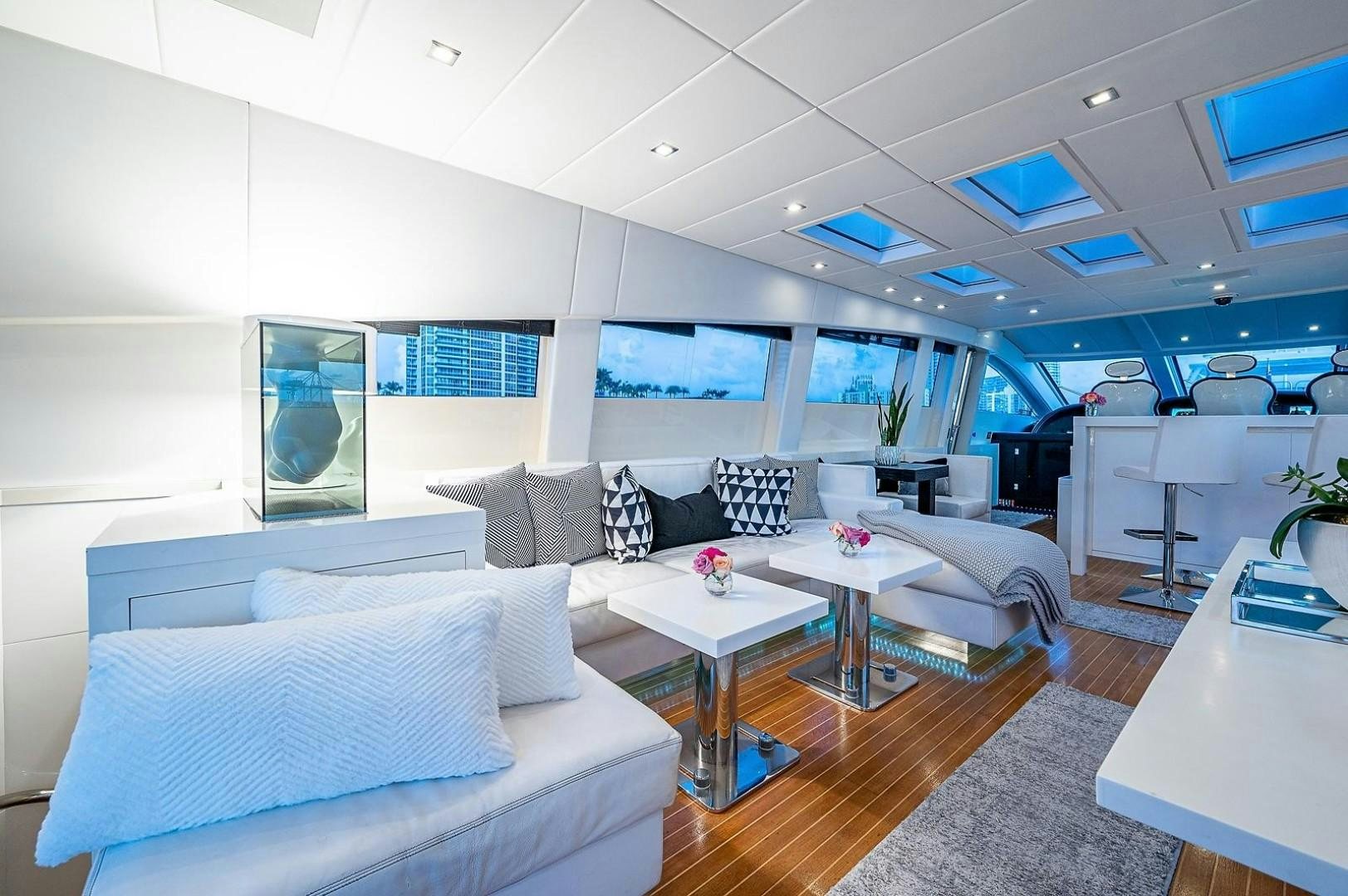 a room with a couch and a table aboard CASSINELLA Yacht for Sale