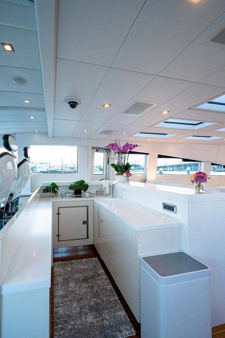 a kitchen with white cabinets aboard CASSINELLA Yacht for Sale