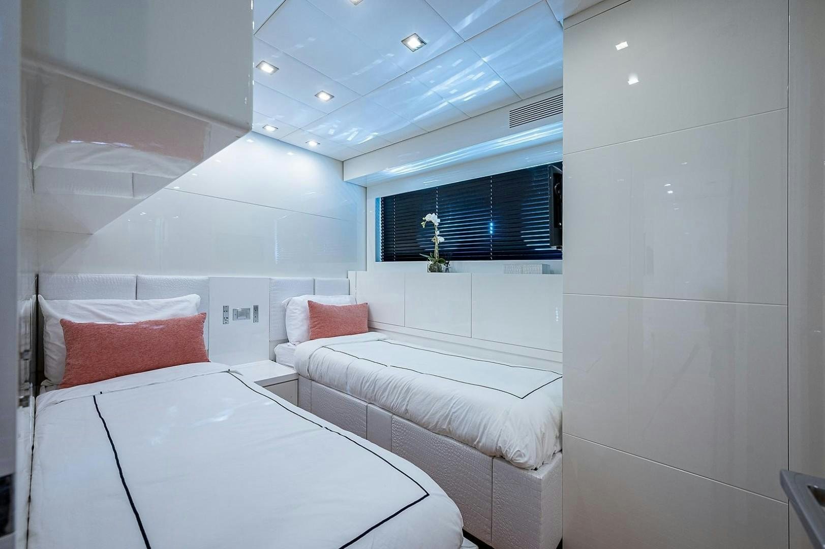 a room with two beds aboard CASSINELLA Yacht for Sale