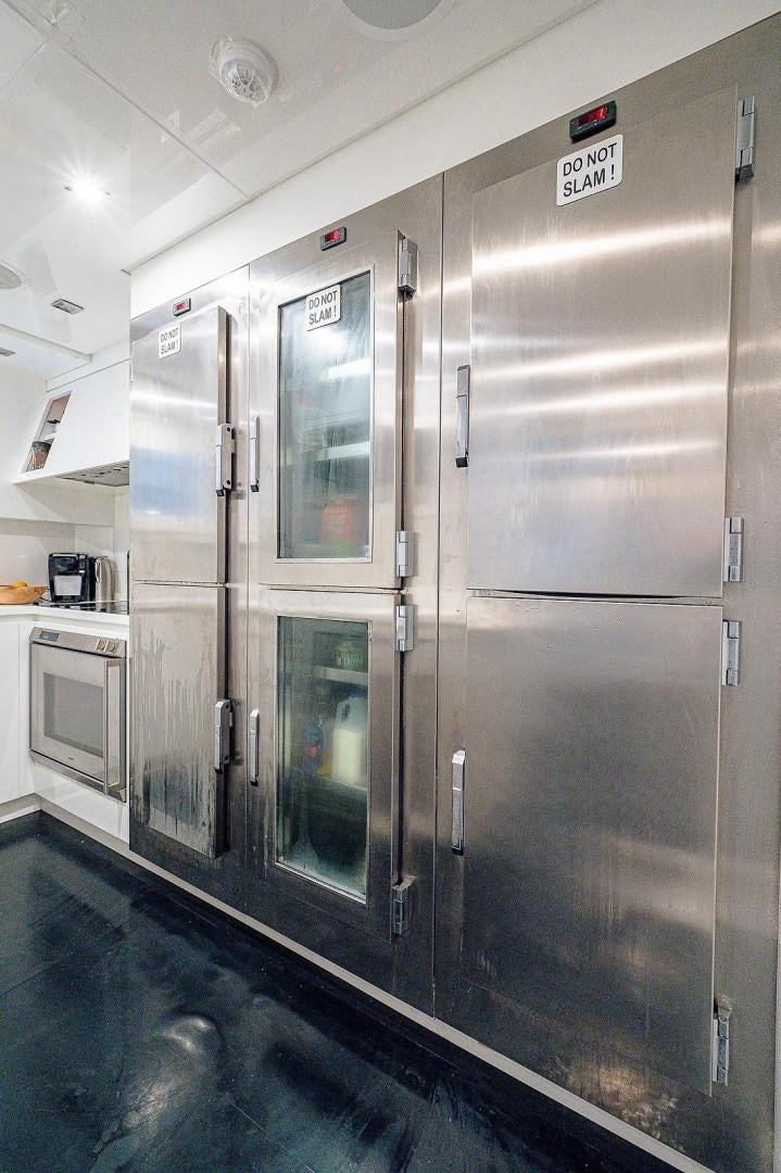 a large silver refrigerator aboard CASSINELLA Yacht for Sale