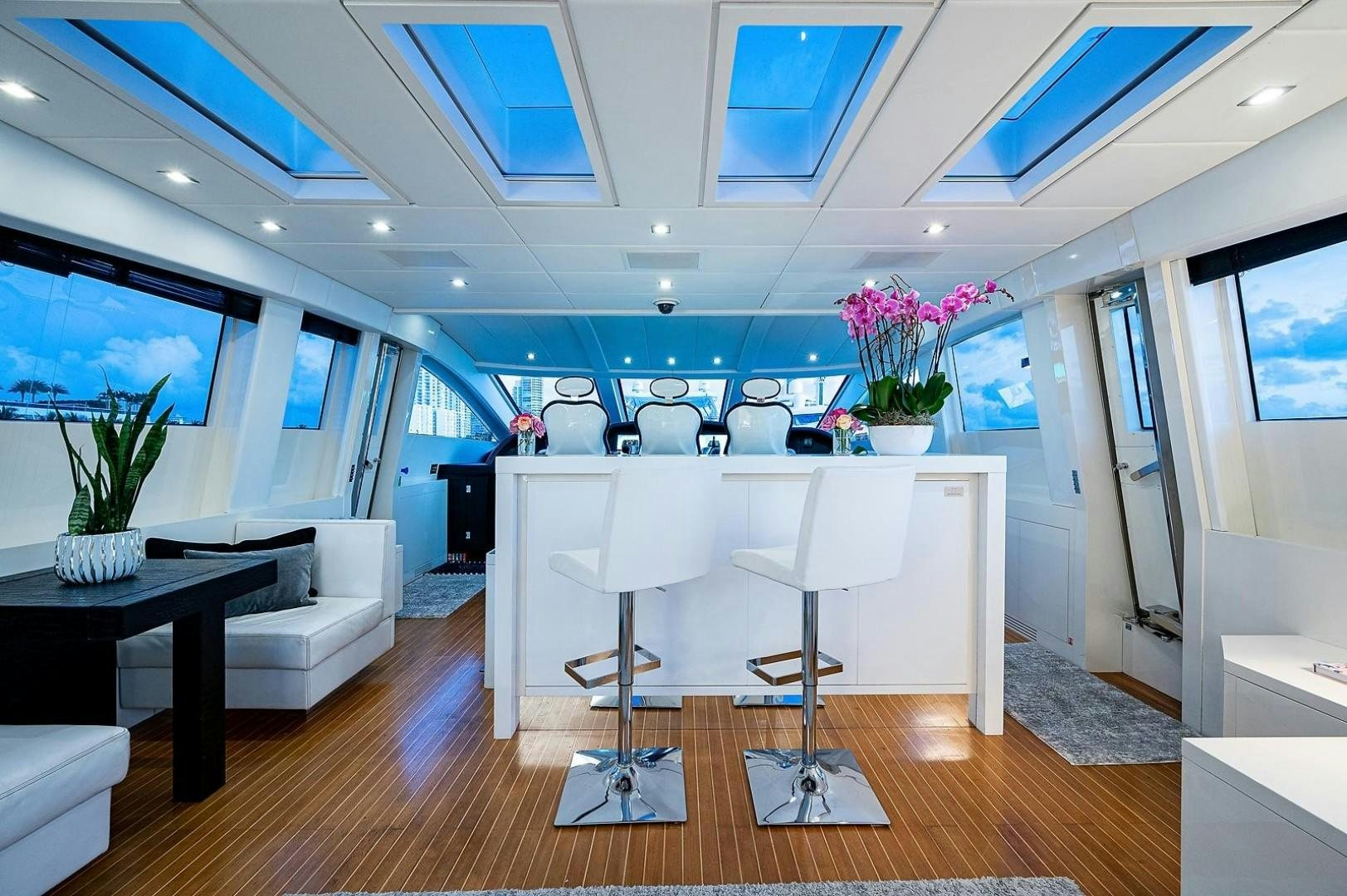 a room with a table and chairs aboard CASSINELLA Yacht for Sale