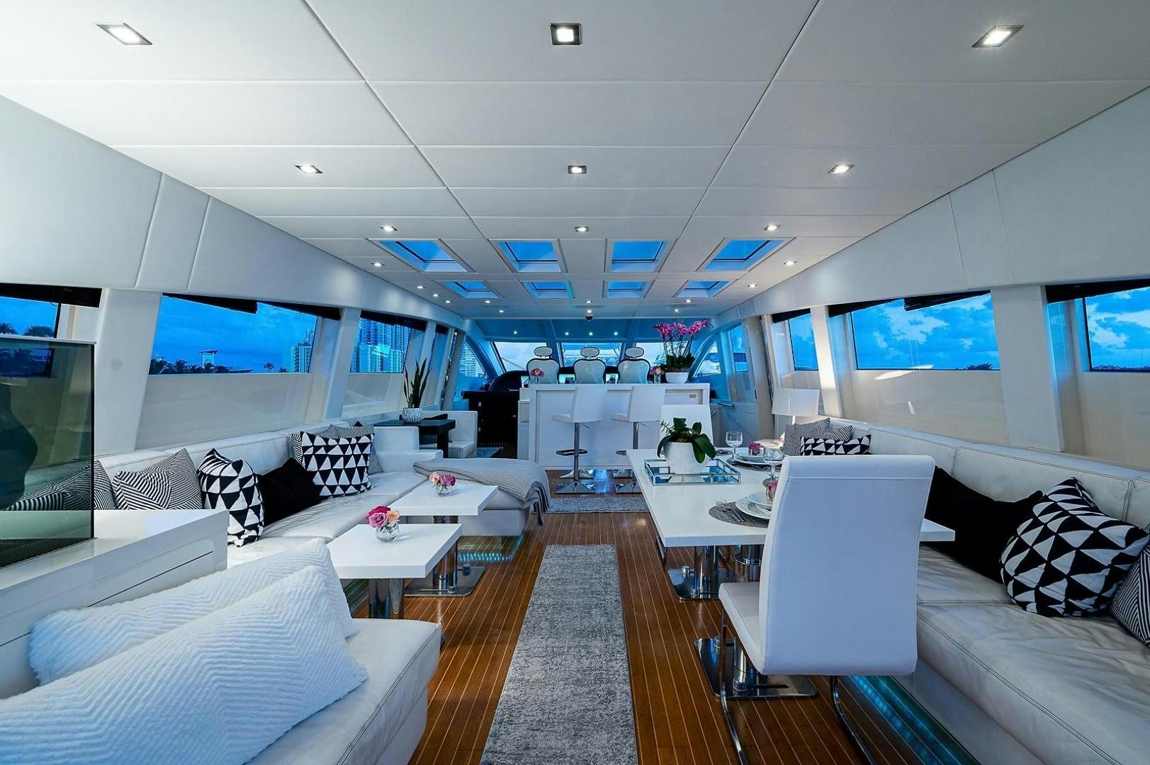 a room with a couch and a tv aboard CASSINELLA Yacht for Sale