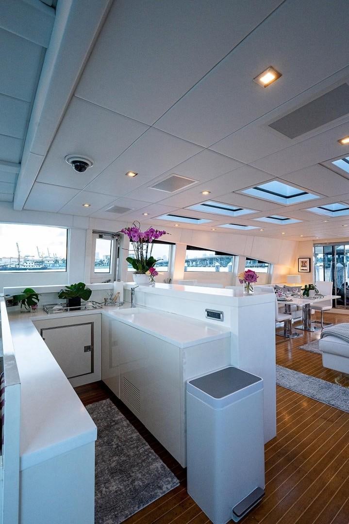 a kitchen with white cabinets aboard CASSINELLA Yacht for Sale