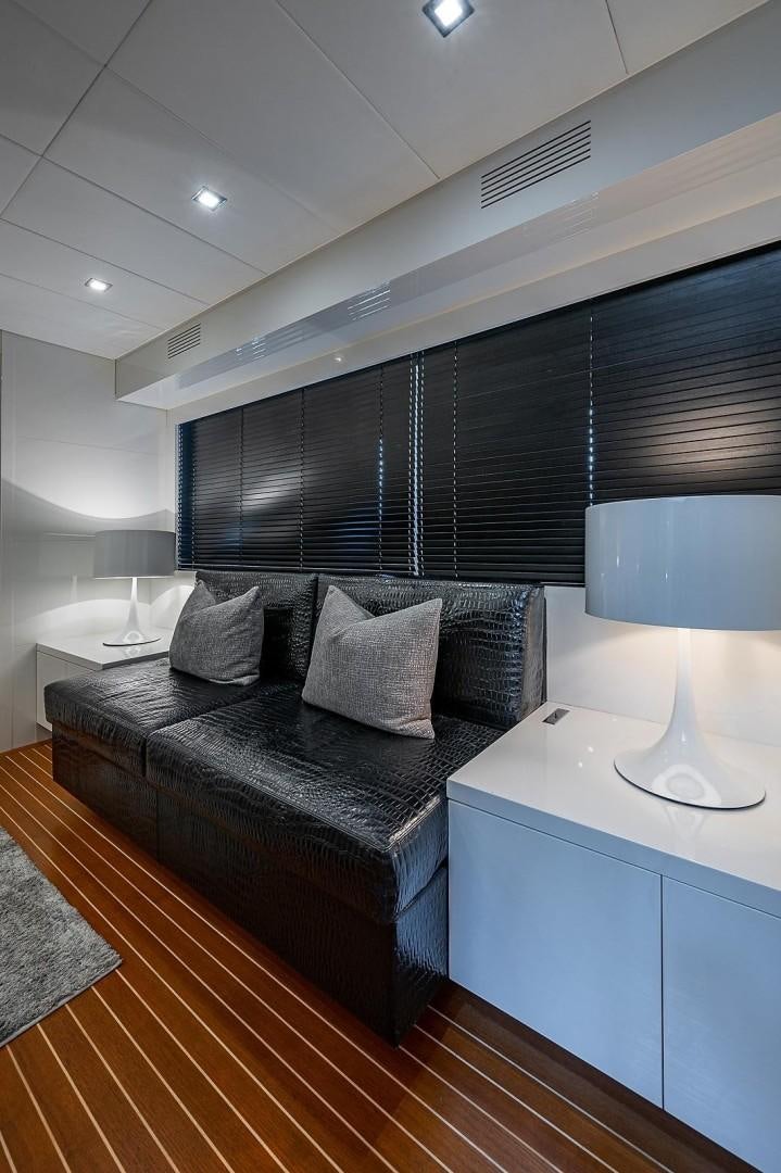 a bed in a room aboard CASSINELLA Yacht for Sale