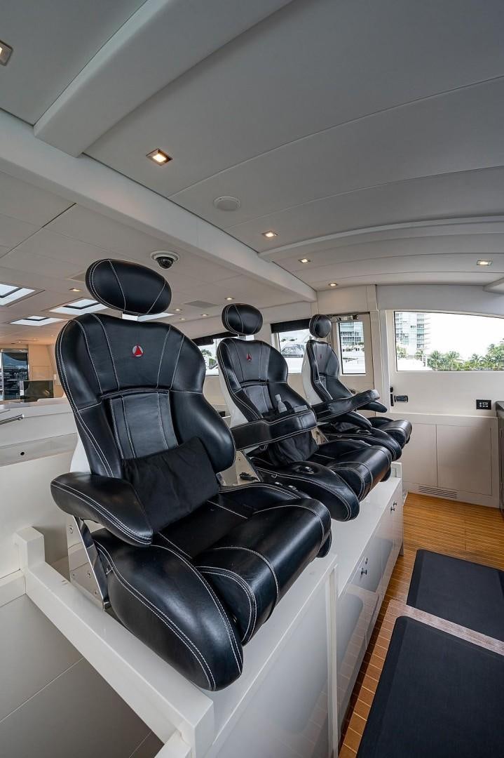 a group of chairs in a room aboard CASSINELLA Yacht for Sale