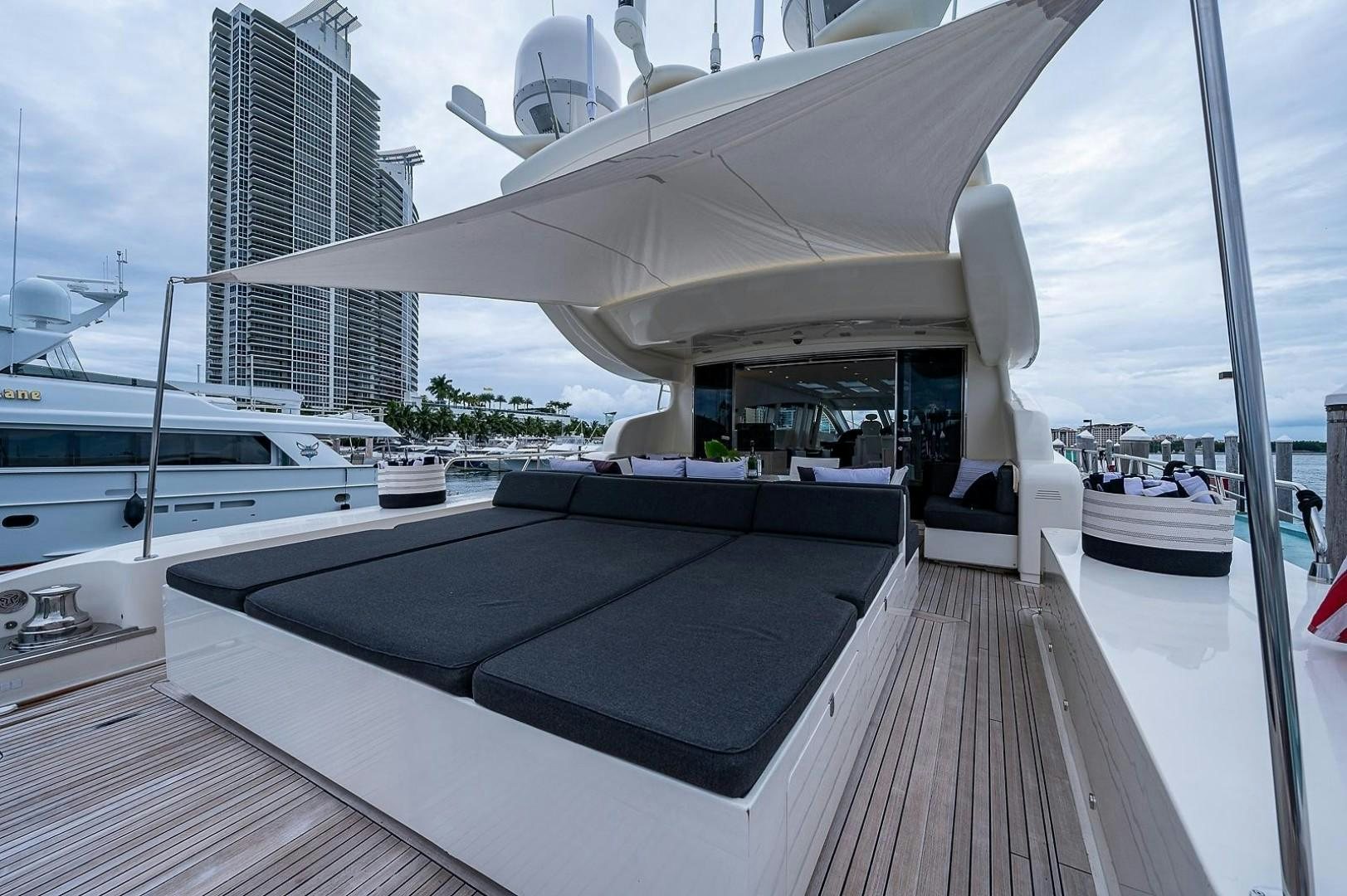 a deck with a large building in the background aboard CASSINELLA Yacht for Sale