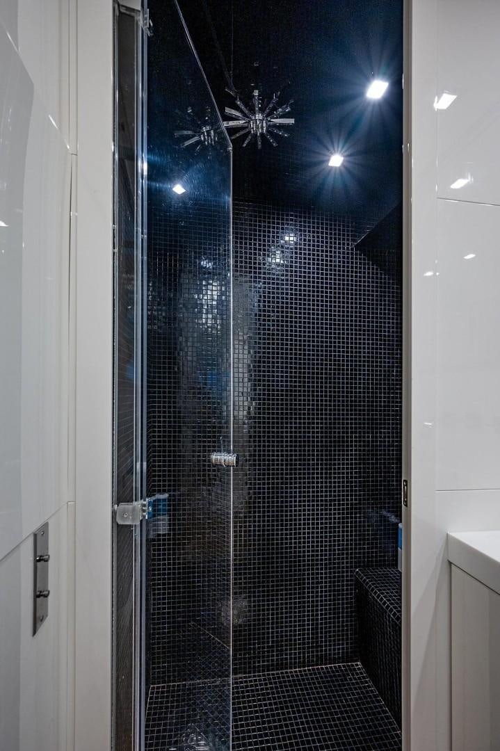 a shower unit with a glass door aboard CASSINELLA Yacht for Sale