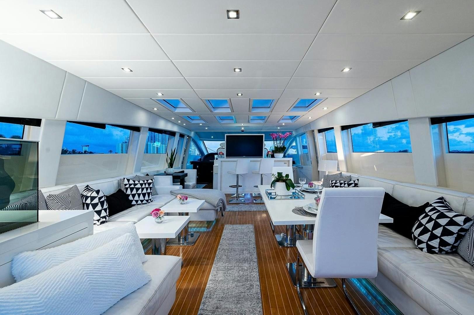 a room with a couch and a tv aboard CASSINELLA Yacht for Sale