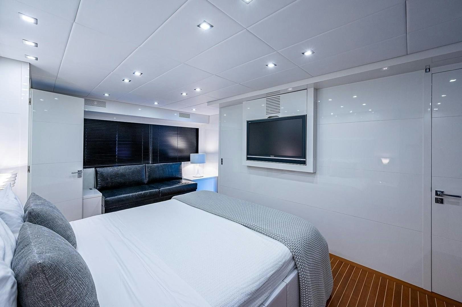 a room with a tv and a couch aboard CASSINELLA Yacht for Sale
