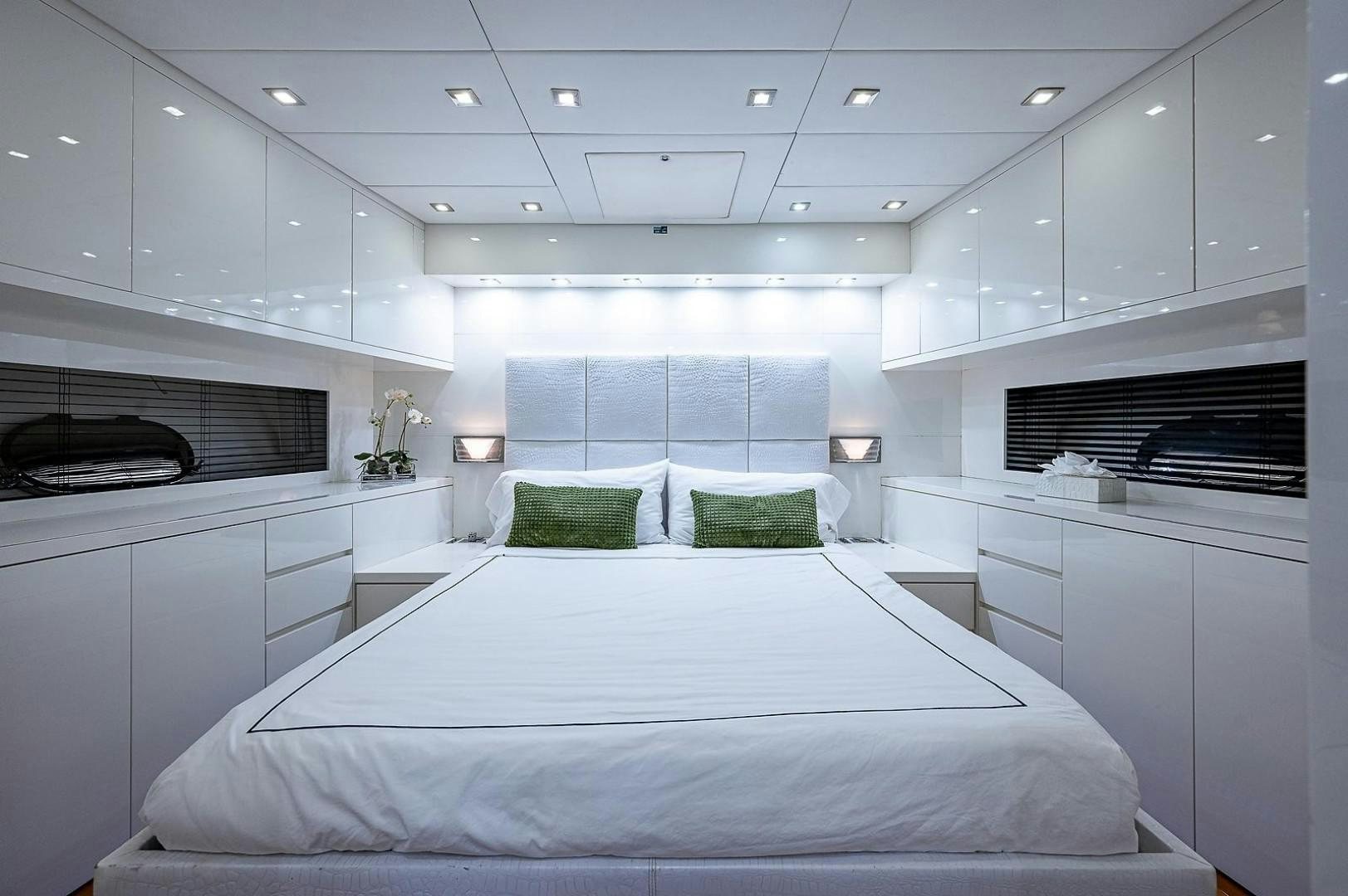a large white bed in a room aboard CASSINELLA Yacht for Sale
