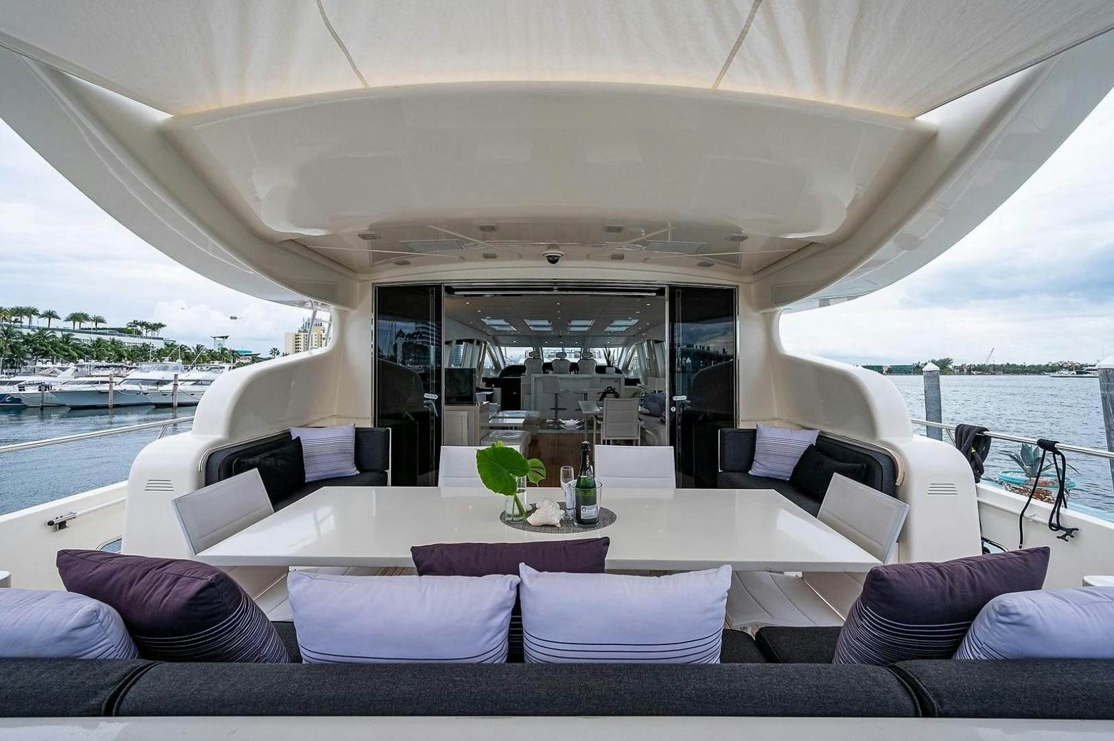 a boat with a table and chairs aboard CASSINELLA Yacht for Sale