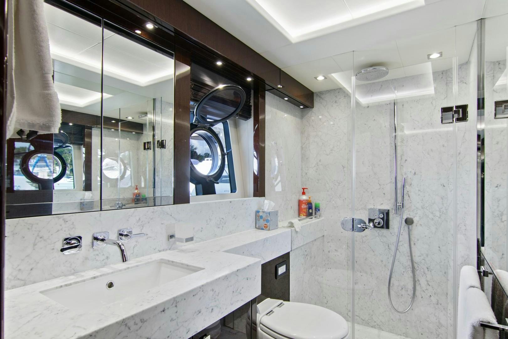 a bathroom with a large mirror aboard GOLDEN OURS Yacht for Sale
