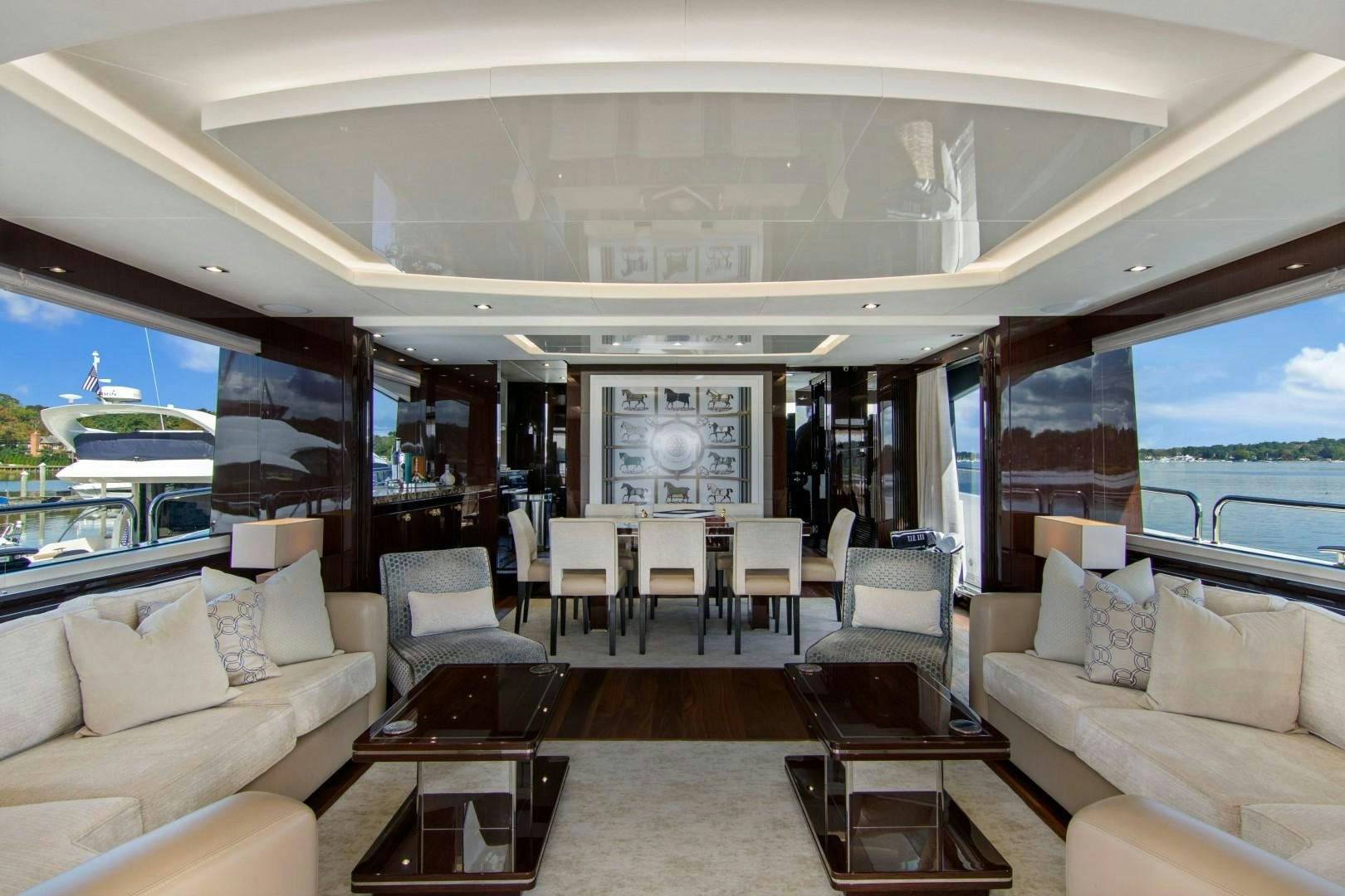 a living room with a large window aboard GOLDEN OURS Yacht for Sale