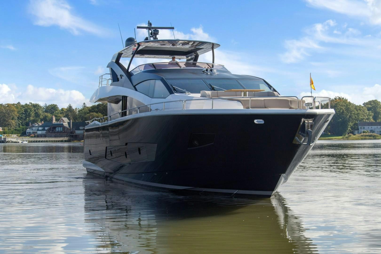 a large boat on the water aboard GOLDEN OURS Yacht for Sale
