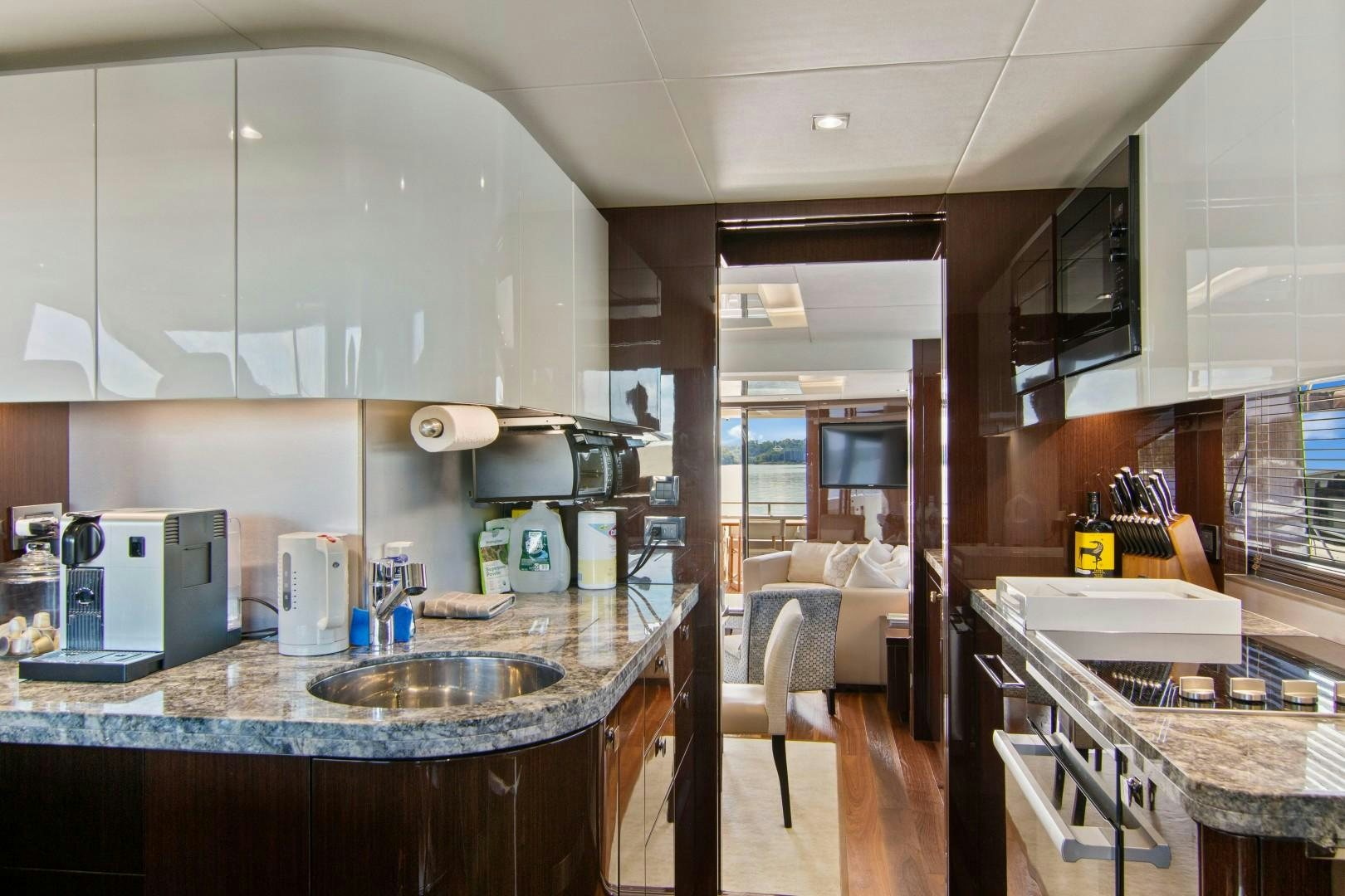 a kitchen with a sink and a microwave aboard GOLDEN OURS Yacht for Sale
