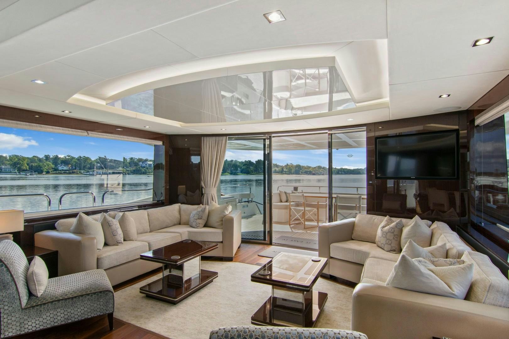 a living room with a large window aboard GOLDEN OURS Yacht for Sale