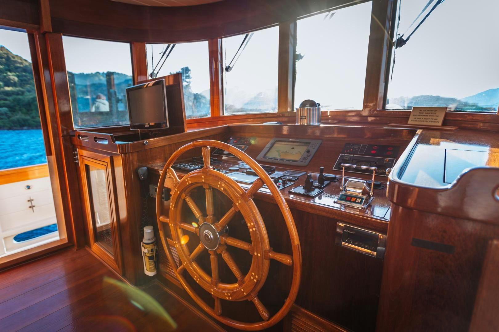 a wooden car with a large wooden wheel and a large window aboard LARIMAR Yacht for Sale