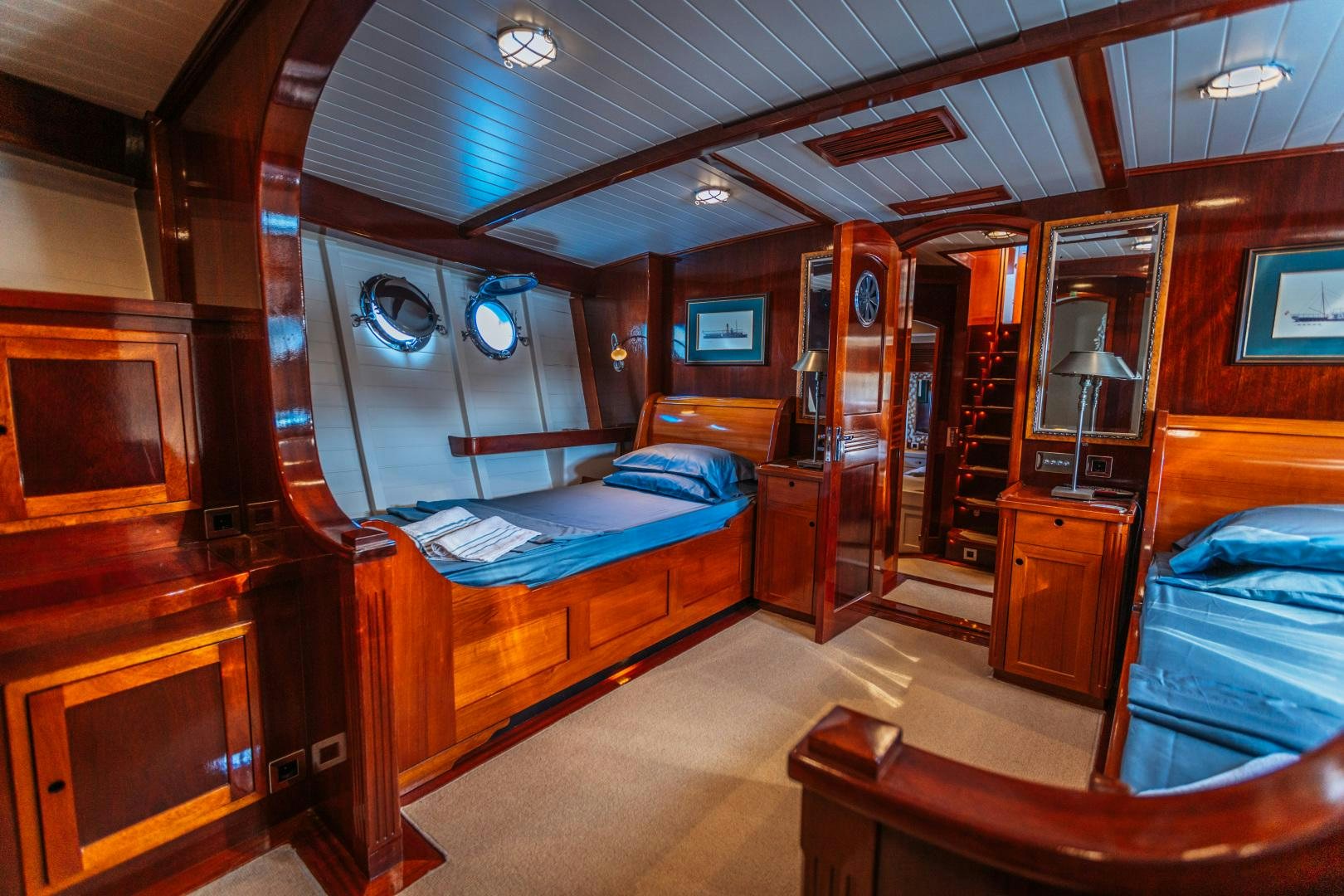 a room with a bed and a desk aboard LARIMAR Yacht for Sale
